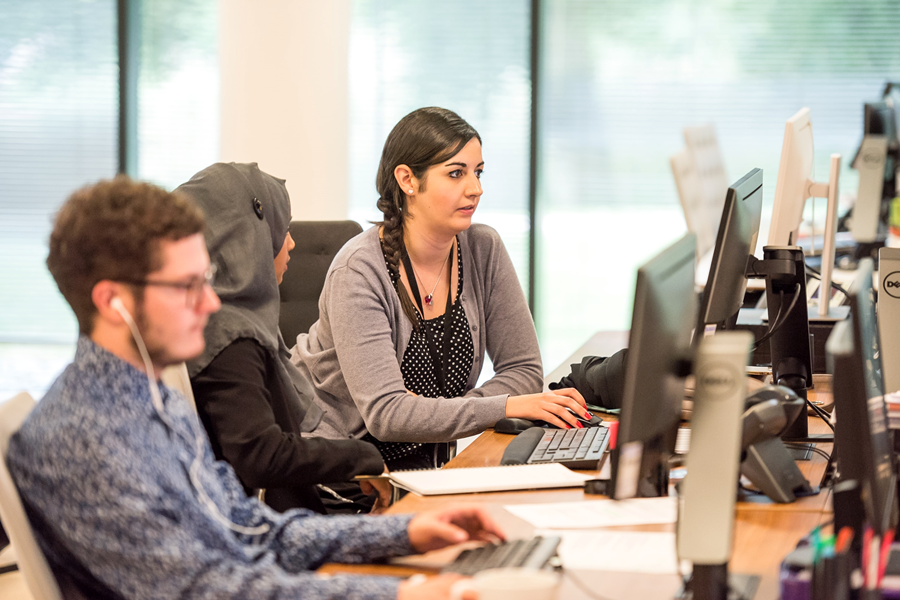 Work experience, two people in front of a computer