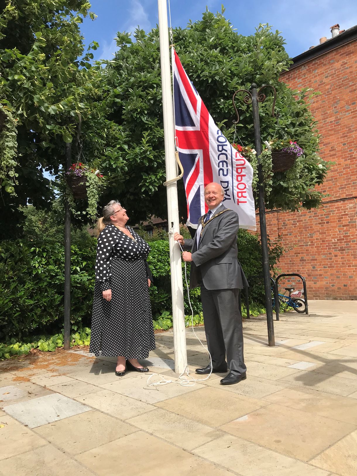 Mayor councillor Hatley raises the flag in Romsey