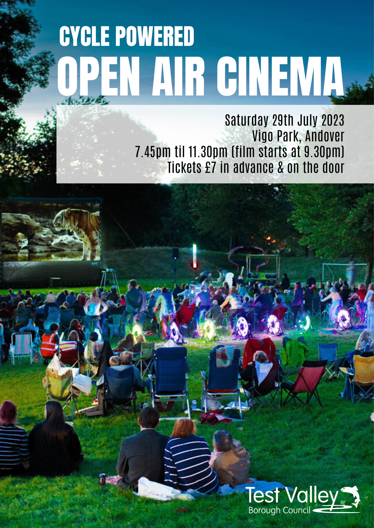 Cycle powered open air Cinema 2023 - People in the park cycling to power the movie screen